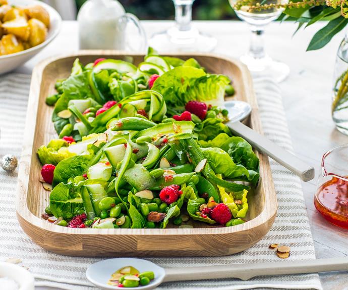 Green salad with shaved cucumber, peas, mint and raspberry dressing