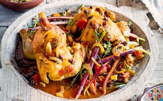 Baked baby chicken in saffron with fruit and nut couscous