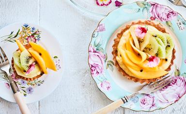 Summer custard fruit tarts with passionfruit and lime syrup
