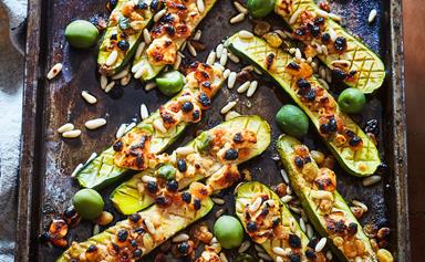 Grilled cheesy courgettes with pine nuts and olives