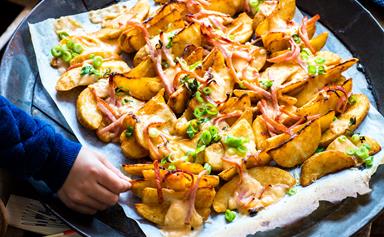 Loaded potato wedges with smoked cheese sauce and bacon