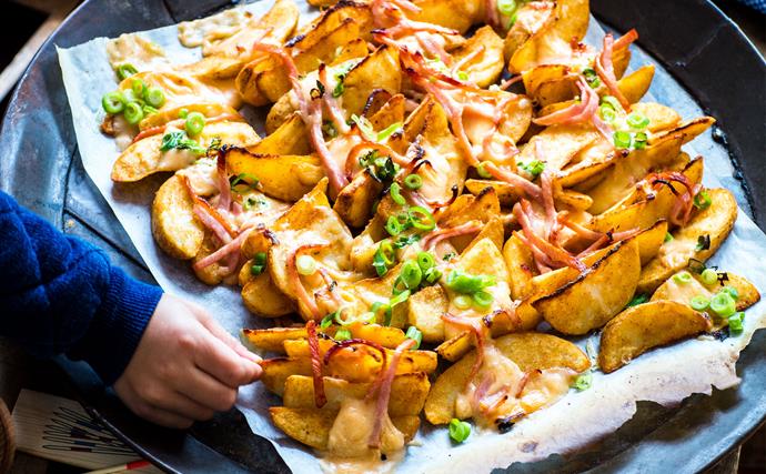 Loaded wedges with smoked cheese sauce and crispy bacon