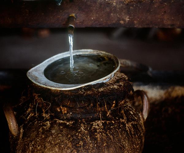 *Clay-pot stills being used to distil mezcal in Mexico*