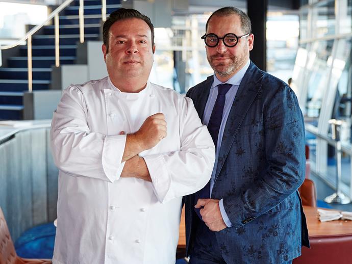 **RESTAURANT OF THE YEAR: [QUAY](https://www.gourmettraveller.com.au/dining-out/restaurant-reviews/new-quay-review-16224|target="_blank"), SYDNEY**
<br><br>
No pressure. But when you're running one of the most visible, celebrated and (yes) expensive restaurants in the country, and you spend three months and many millions rethinking the place from the carpet up, there's going to be a certain amount of scrutiny from the dedicated diners of Australia when you throw open the doors. Such is the nature of a special-occasion restaurant; your guests develop an emotional investment in what you do. They don't think of it as your place, but as their place. (Retire your [snow egg](https://www.gourmettraveller.com.au/news/restaurant-news/the-last-snow-egg-15725|target="_blank") at your peril, and be careful what you do with your tablecloths.) 
<br><br>
But just about everything at the new Quay has been done to put the focus back on the diner. Peter Gilmore is no one-trick pony and The Fink Group's big gamble has paid off. The new Quay does everything the old Quay did – the dazzling food, the sense of occasion – while trimming away the hint of the rote, of the production-line that had rankled with some diners. Our  reviewers noted in last year's guide that certain "naff, nanna and negligent" aspects of service had begun to creep into the experience. A year down the track and the Quay of today is a long way from any of those things. Jeremy Courmadias, a Le Caprice alumnus who gave new polish to Rockpool Bar & Grill in his previous job, has brought a very welcome transformation to the service culture. And Gilmore and his team, reveling in a  new-build kitchen, are flexing their muscles anew. It's a new Quay, and there's no other restaurant quite like it. 
<br><br>
*Quay, Upper Level, Overseas Passenger Terminal, The Rocks, NSW, (02) 9251 5600, [quay.com.au](https://www.quay.com.au/|target="_blank"|rel="nofollow")*
<br><br>
*Pictured: chef Peter Gilmore and Fink Group's creative director John Fink*