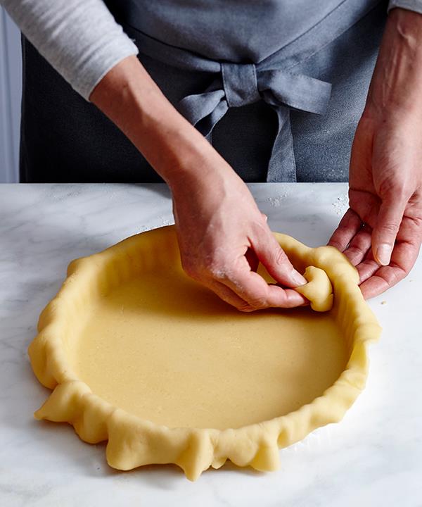 Use pastry trimmings to "push" the pastry to the edges of the tin