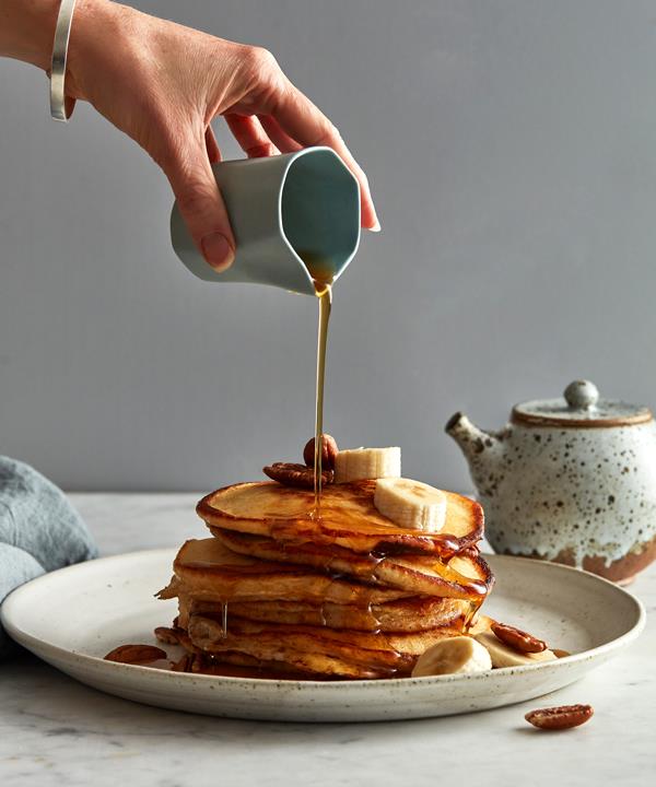 My favourite toppings are fresh sliced banana, roasted pecans, and maple syrup. In Australia, malt syrup is an awesome alternative. Stay away from the fake maple stuff. I am also a sucker for pancakes with canned peaches and crème fraîche – it sounds naff, but it's super tasty.