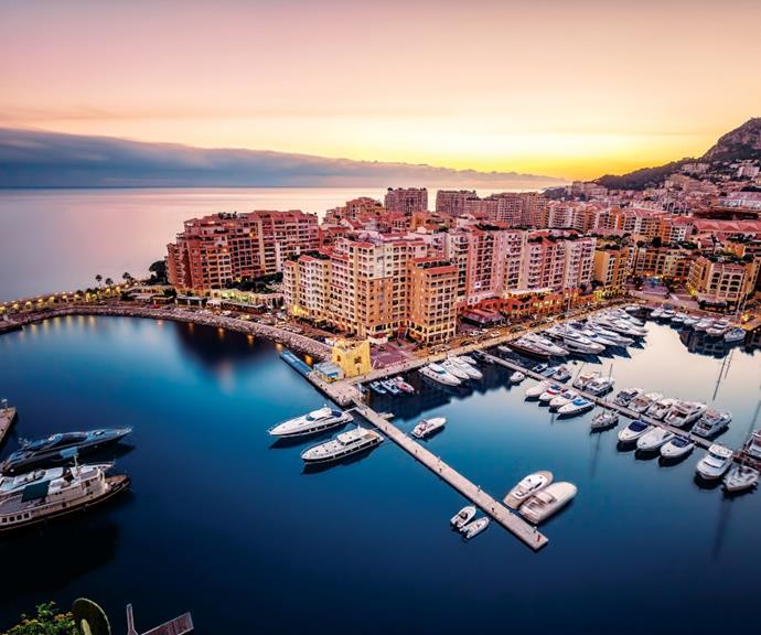 The sun setting over the harbour in Monaco.