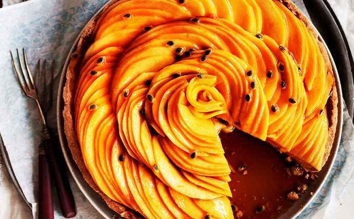 Photo of a golden mango and passionfruit caramel tart