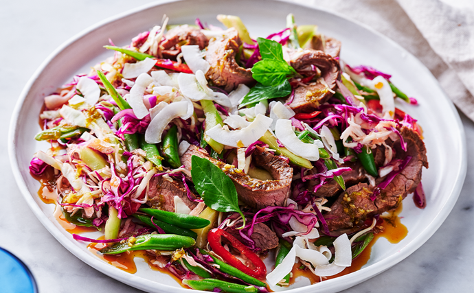 A plate of seared beef tossed through a palm sugar and coconut slaw.