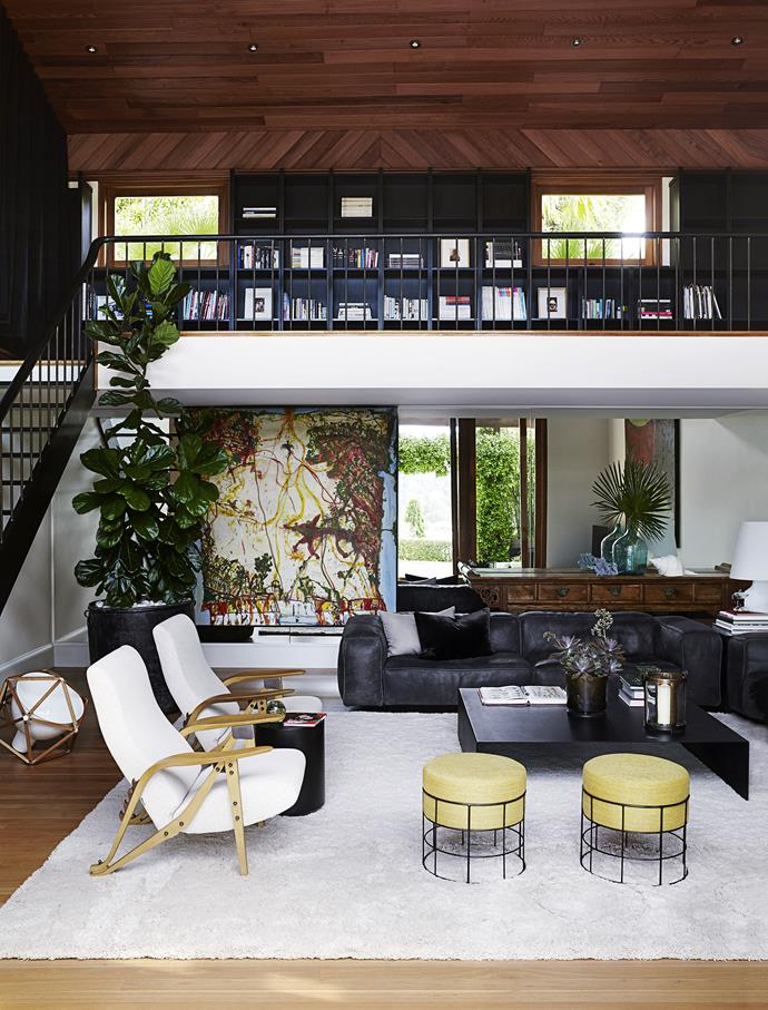 Designed by architect Michael Robilliard in the early 1990s, the home on Sydney's North Shore certainly had the bones to last the distance. He introduced a series of pavilions, making the living areas light and airy. But the house also retained less desirable hallmarks of that era – “sponged butterscotch” interior walls, yellow granite benchtops and glossy timber – fashionable then, but now looking tired. 

Edra Sofà **sofas** and Zanotta Gilda **armchairs** from [Space](http://www.spacefurniture.com.au/|target="_blank"). **Cushions** in [Boyac](http://www.boyac.com.au/|target="_blank") and [Elliott Clarke](http://www.elliottclarke.com.au|target="_blank") fabrics. Custom-made **coffee table** and **footstools**. Shag alpaca **rug** from [Alfredo Custom Furniture Inc, US](http://www.alfredocustomfurniture.com/|target="_blank"). Henry Pilcher Block 2 **floor lamp** from [Anibou](http://www.anibou.com.au/|target="_blank"). Fontana Arte **lamp** from [Surrounding](http://www.surrounding.com.au/|target="_blank"). The mezzanine features a home cinema. *Table Landscape* **artwork** by [John Olsen](http://www.olsenirwin.com/pages/johnolsen.php/|target="_blank").