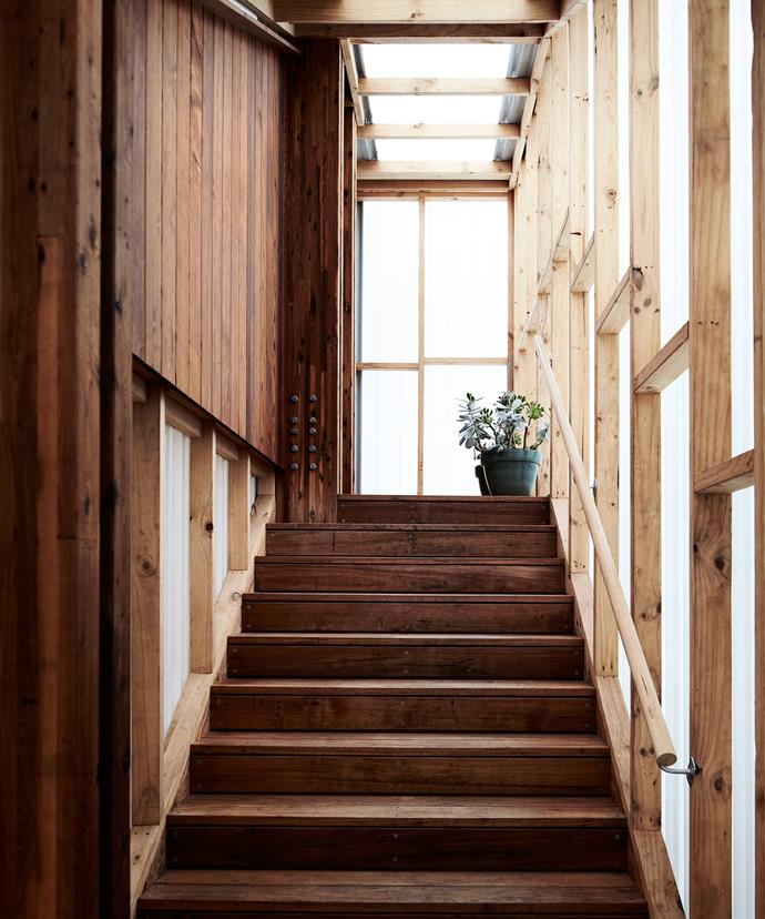 "This area has a lovely milky light by day and glows by night, indicating the pavilion is occupied," architect Clare Cousins says of the polycarbonate stairwell that joins this timber extension to the original brick house.