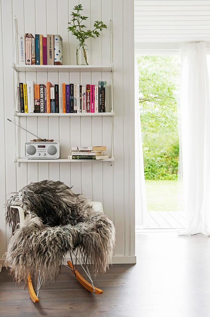 The perfect reading nook – a fluffy sheepskin rug thrown over an Eames RAR Rocker chair. Shelves are from [Ikea](http://www.ikea.com.au/|target="_blank").