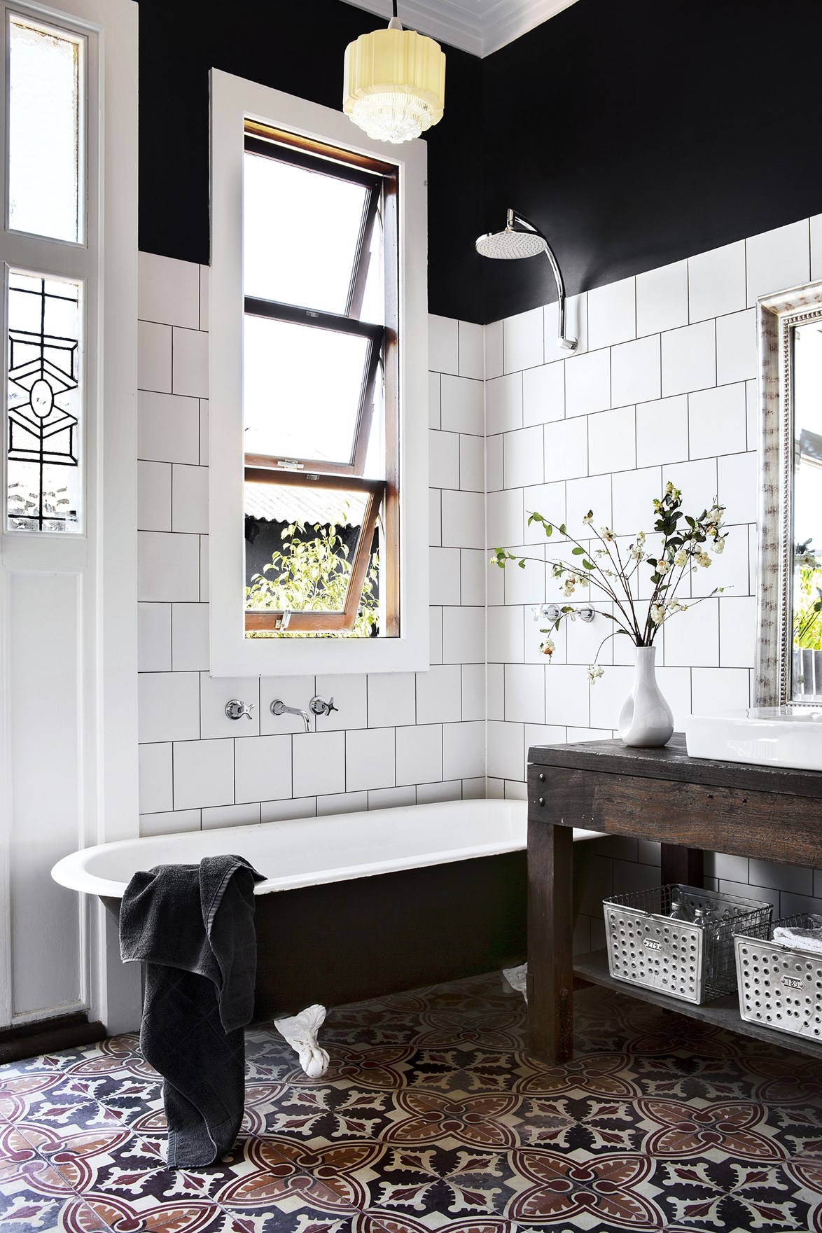 You could be forgiven for thinking that this is a restored bathroom in a heritage home, but it's actually a [new build created from recycled and re-purposed materials](https://www.homestolove.com.au/gallery-carla-and-bens-art-deco-style-new-house-1798|target="_blank"). A mix of modern and vintage pieces give the home it's country meets art-deco flair.