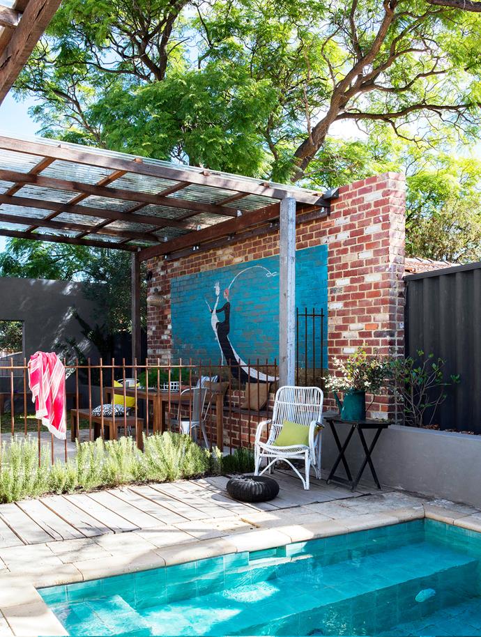 The pool fence, made by Ben from steel-reinforcing bars, is designed to rust and add character to the outdoor courtyard. The wicker chair was rescued from the roadside and refreshed with white paint. The reclaimed limestone pavers are easy to maintain and develop a beautiful patina over time.