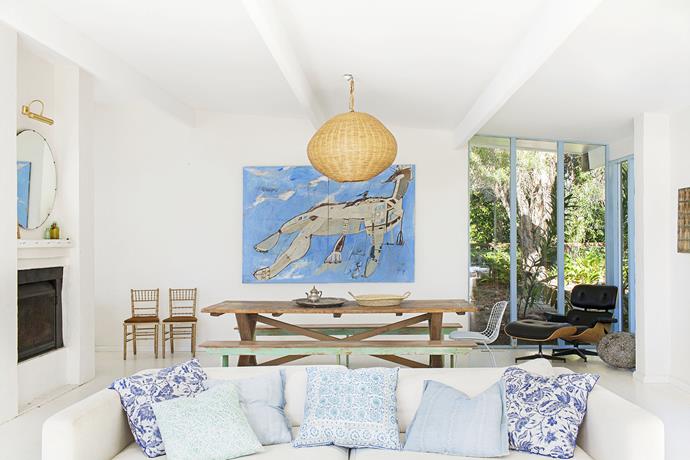 A palette of soft blues, white and timber creates a relaxed beachy vibe in the open-plan living area. The artwork is an interpretation of the Barrenjoey Headland by [George Raftopoulos](http://www.georgeraftopoulos.com/|target="_blank").