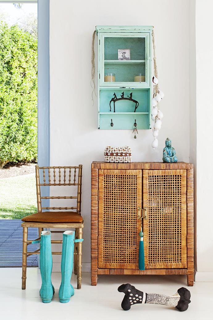 A [John & Ginger](http://johnandginger.com.au/|target="_blank") rattan cupboard by the back door houses the family’s shoes. Heidi’s gum boots and the wall shelves, from Indonesia, fit in perfectly with the colour scheme.