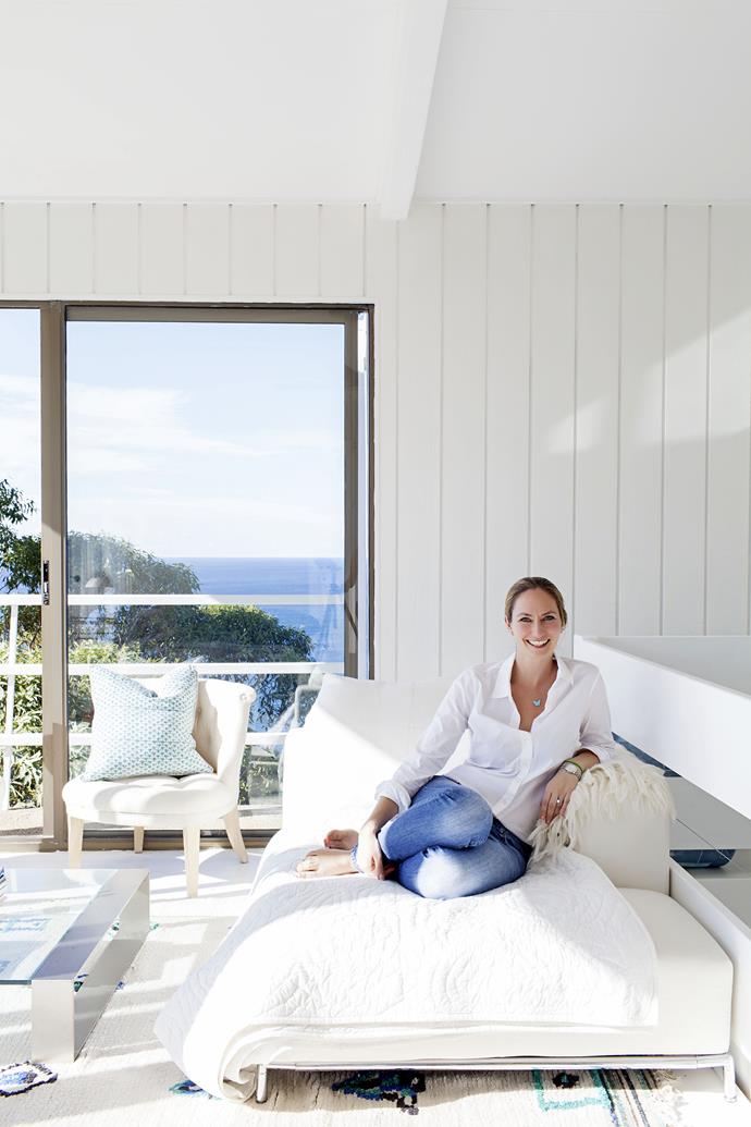 Heidi sits in her favourite spot of the beach house – the light and airy top “tower” storey, which comprises the master bedroom, study, and a living space the family call the “cocktail area”.