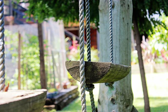 Old wooden swings, found near the back fence of the property, were restored and re-hung to create a perfect place to play outdoors.