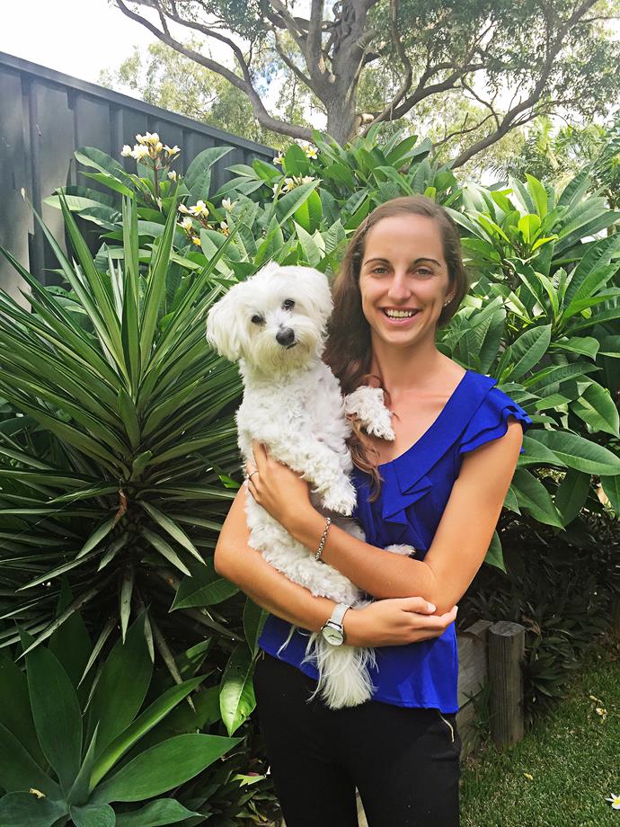 Jess, pictured here with her Maltese Shih Tzu, Wags, layered her garden with a variety of lush tropical plants.