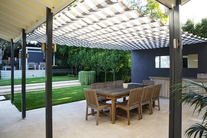 The easy flow between the zones creates a casual, holiday-at-home feeling, designed to sustain the family for many summers to come. 

The dining area’s fully extended awning is in [Dickson](http://www.dickson-constant.com/en/UK/outdoor-furnishing|target="_blank") solar-protection fabric.