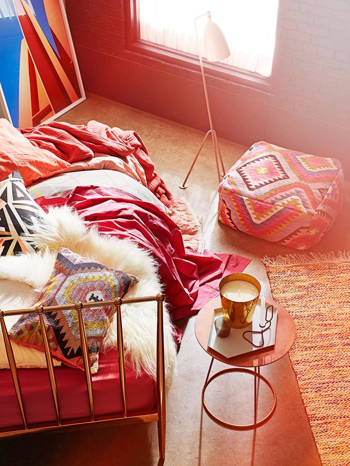 **Desert pop:** Warm metallic accessories cast a soft glow on touchy-feely bedlinen and bedouin-inspired homewares in sunset hues of rose, tan and coral. 

Coppa **bed** from [Domayne](http://www.domayneonline.com.au/|target="_blank"). Swedese Breeze **side table** in Copper from [Fred](http://www.fredishere.com.au/|target="_blank"). Grossman Grasshopper **floor lamp** from [Cult](http://www.cultdesign.com.au/|target="_blank"). Sunset photographic **artwork** by Adrian Mesko from [MCM House](http://mcmhouse.com/|target="_blank"). **ON BED** Icelandic **sheepskin** from [Cult](http://www.cultdesign.com.au/|target="_blank"). Chembra Tamba **cushion** from [Ivy Lane](http://www.ivylane.com.au/|target="_blank"). Deco Deco **cushion cover** in Metallic Ink from [Citta Design](http://www.cittadesign.com/|target="_blank"). French rock-washed linen **pillowcase** in Blush from [Cotton Love Home](http://www.cottonlove.com.au/|target="_blank"). Nite **sheet** in Candy, and Nuit **blanket** in Candy, both from [Ondene](http://www.ondene.com.au/ondene/home.html|target="_blank"). Hay Polygon **quilt** in Powder from [Cult](http://www.cultdesign.com.au/|target="_blank"). PS 2014 **quilt cover set** in Multicolour from [Ikea](http://www.ikea.com.au/|target="_blank"). *real living* for [Freedom](http://www.freedom.com.au/|target="_blank") My Love **rug**.