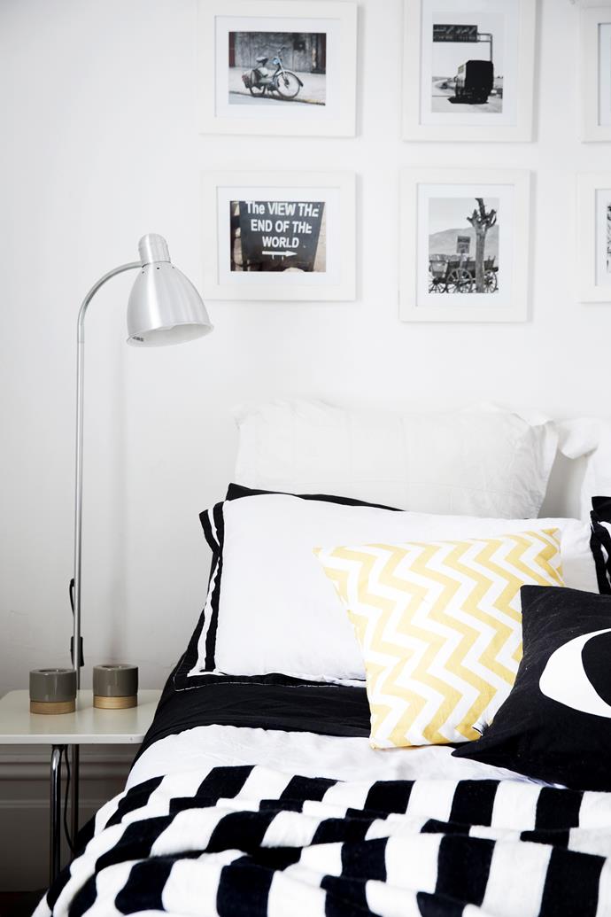 Black-and-white framed photos are an inexpensive way to give a room personality, and the display is in keeping with the home’s restrained colour palette.