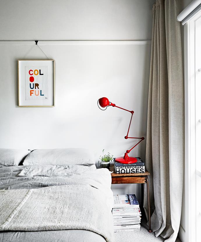 In the main bedroom, art adds a pop of colour, along with the original Jielde lamp. An old flip-lid school desk is used as a bedside table. The lamp, a classic mid-century French design, was for a client, but two were accidentally sent so the family got to keep this one.

Jielde **lamp** from [Euroluce](http://euroluce.com.au/|target="_blank"). **Artwork** by [Rachel Castle](http://www.castleandthings.com.au/|target="_blank").