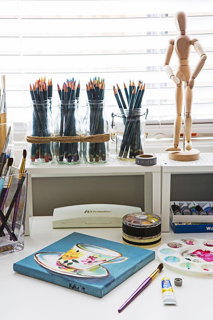 Katie does drawing and watercolour in the home office and stores her supplies in jars.