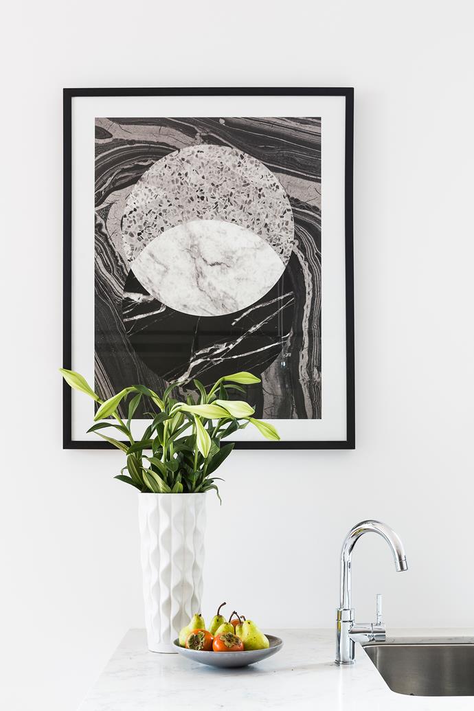 The contemporary black and white palette is carried right through to artworks. *Middle Of Nowhere Infinity* framed print from [Life Interiors](http://www.lifeinteriors.com.au/|target="_blank").
