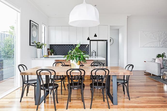 Rachel loves the way the timber flooring continues up the back of the kitchen bench. It matches the dining table perfectly.

Bentwood **chairs** in Black from [Connect Furniture].