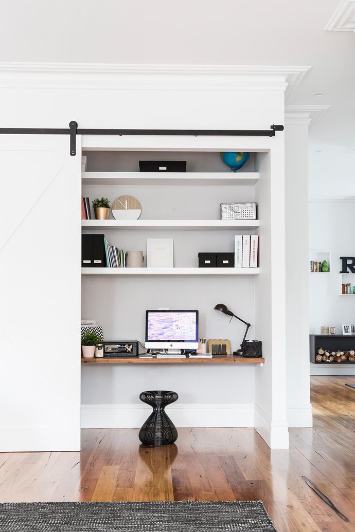 This study nook is cleverly concealed behind a sliding door within a living room. Photo: Maree Homer / bauersyndication.com.au