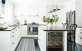 Hamptons-style white kitchen with wine fridge