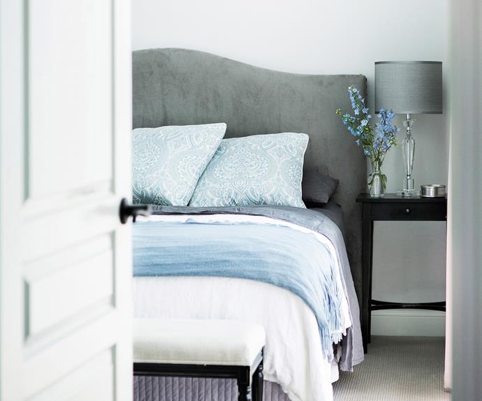 Hamptons-style master bedroom with a blue and grey colour scheme