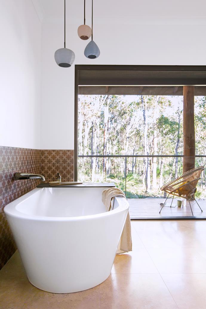 **Room #19 by [Remedy](http://www.remedyonline.net.au/?utm_campaign=supplier/|target="_blank")** For their home in Yallingup, in WA’s Margaret River region, Melanie and Joe wanted a bathroom that brought the surrounding bushland into the daily bathing experience. Both bath and shower are positioned to take full advantage of the view, while the toilet is neatly hidden behind a return wall with built-in open shelving for storage. Giving strength to the room are Patricia Urquiola-designed tiles and a cluster of Mod Collective pendants. Photo: James Knowler.