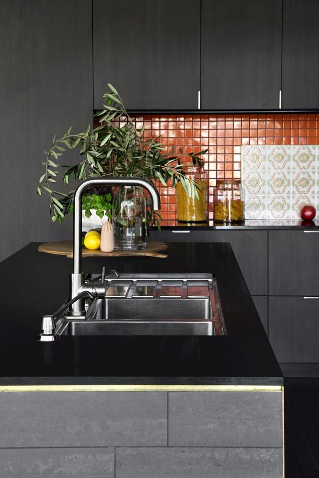 Moody hues work miracles in this [70s inspired kitchen](http://www.homestolove.com.au/retro-refit-a-70s-inspired-kitchen-2149/|target="_blank"), and with bi-fold doors that open to the garden, there's no danger of it feeling gloomy.