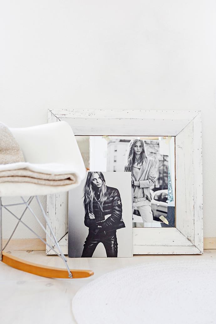 An Eames DSW Rocker chair and a couple of edgy black-and-white fashion pics decorate an empty corner in the master bedroom.