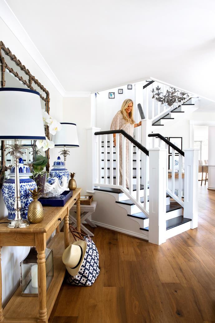Natalee descends the elegant central staircase.

**Console** and **mirror** from [Restoration Hardware](https://www.restorationhardware.com/?utm_campaign=supplier/|target="_blank"). **Pendant light** from [Troy Lighting](http://www.lightco.com.au/?utm_campaign=supplier/|target="_blank"). Table **lamps** from [Emac & Lawton](http://www.emac-lawton.com.au/?utm_campaign=supplier/|target="_blank"), with shades by [Indah Island](http://www.indahisland.com/?utm_campaign=supplier/|target="_blank").