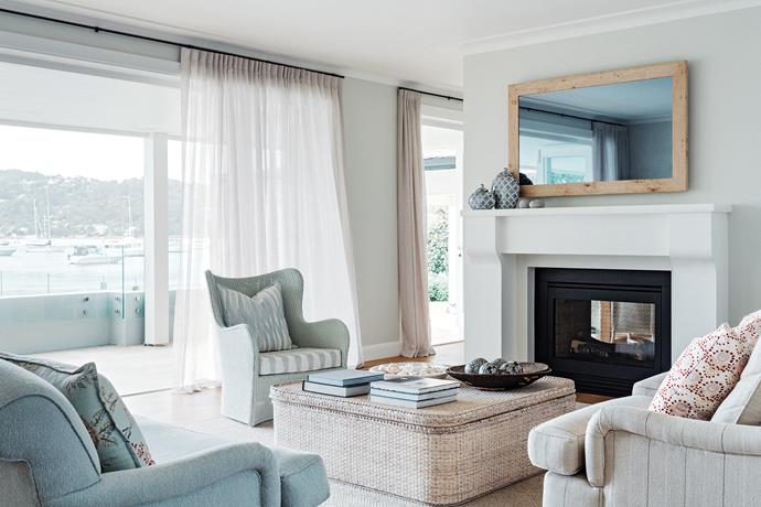 Light and breezy living area has a 'Butterfly XL' white wicker chair and matching wicker coffee table. Oversized furniture is quintessential to the [Hamptons look](https://www.homestolove.com.au/how-to-get-the-hamptons-look-3523|target="_blank").
