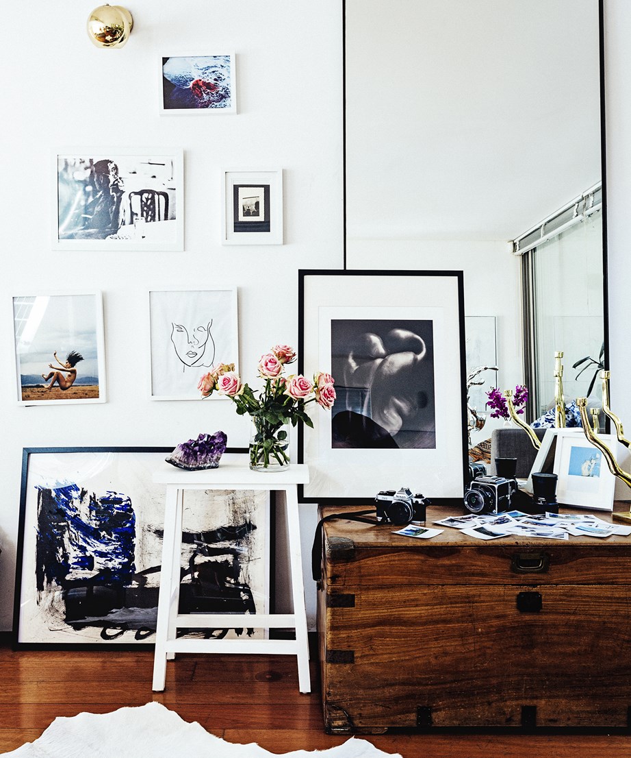 A collection of artworks and photographs were used to fill an empty wall in the home of two Sydney-based artists.