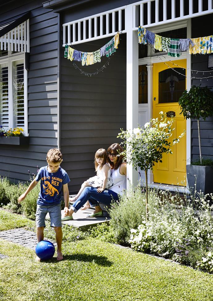 Marissa chose the bright yellow shade for the front door to draw the eye and add a sense of fun to their home's façade. The front garden's feature plants include 'Iceberg' rose and Licorice plant (*Helichrysum petiolare*).