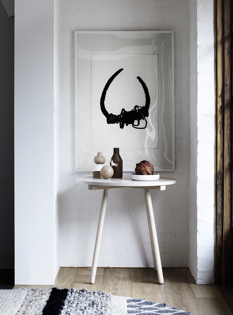 At the very least, you want a place to plonk your keys when you arrive home. This compact nook by the front door houses a small table and a statement artwork to provide a simple yet stylish point of entry.