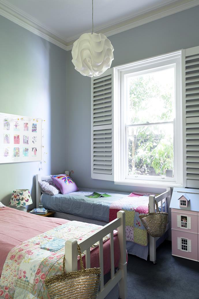 In one of the original front bedrooms, Matilda and Daisy are the fifth generation of the family to sleep in these beds. **Shutters** from [Accent Blinds](http://www.accentblinds.com.au/?utm_campaign=supplier/|target="_blank"). **Pendant** from [Matt Blatt](http://www.mattblatt.com.au/?utm_campaign=supplier/|target="_blank"). **Cushion** from [Coco and Ginger](http://www.cocoandginger.com/?utm_campaign=supplier/|target="_blank") in Bali.