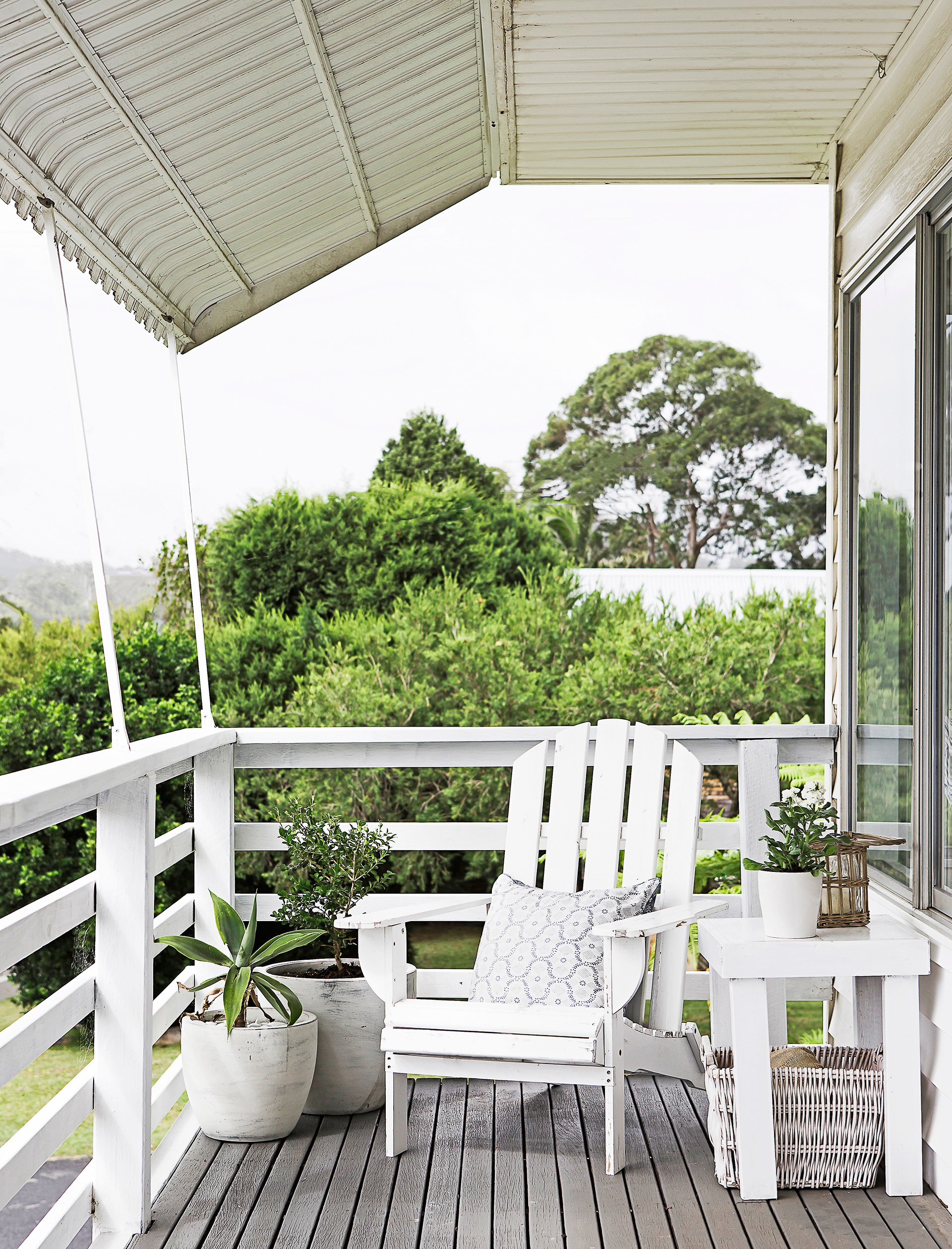 An old cod chair on the deck is in prime position for enjoying the ocean views this Central Coast home has to offer. Take a look inside this [cruisy coastal home](http://www.homestolove.com.au/gallery-stella-and-michaels-coastal-dream-comes-true-2621|target="_blank"). Photo: Maree Homer / *homes+*
