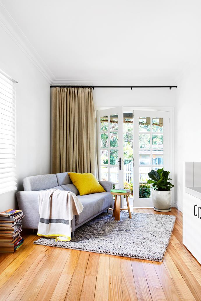 “The house has been designed to take advantage of the natural light, so it feels summery year-round,” says Rebecca. Sofa, [Domo](http://www.domo.com.au//?utm_campaign=supplier/|target="_blank"). **Side table**,  [Jardan](http://www.jardan.com.au//?utm_campaign=supplier/|target="_blank"). **Rug**, Halcyon Lake Rugs and Carpets.