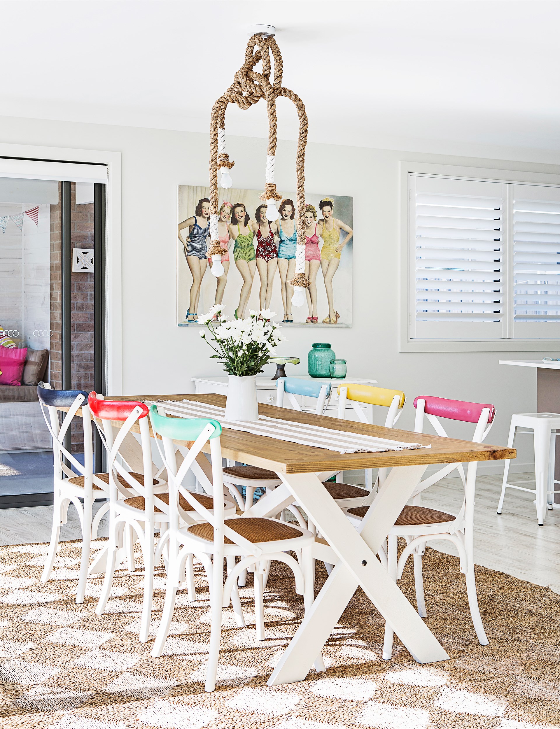 A rope pendant light from [Freedom](http://www.freedom.com.au/?utm_campaign=supplier/|target="_blank") adds to the beachy vibes of this fresh, fun dining area. Take the tour of this [coastal-style overhaul of a single storey home](http://www.homestolove.com.au/empty-nesters-embrace-coastal-style-2918|target="_blank"). Photo: Maree Homer / *homes+*
