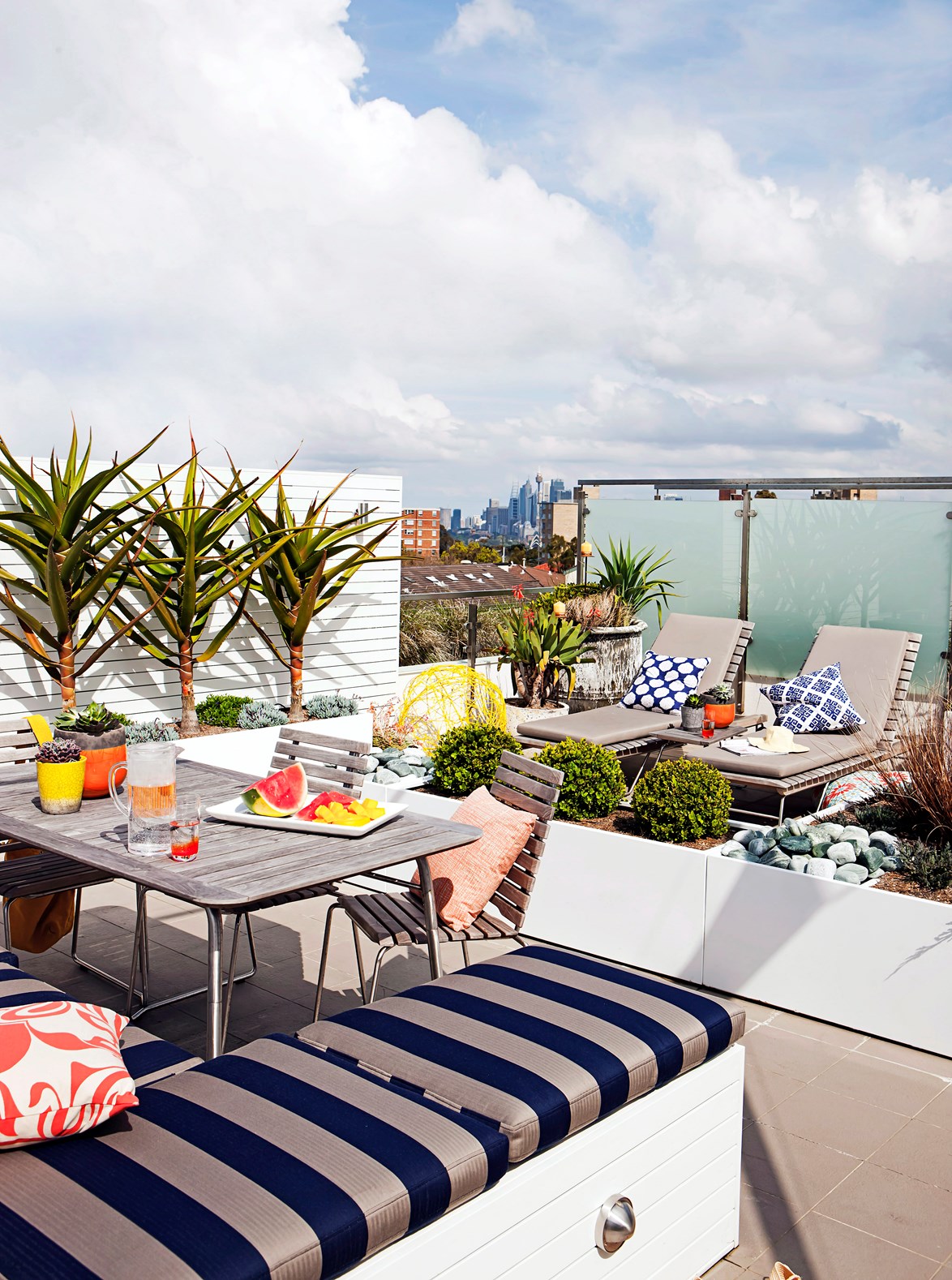The fully-decked-out rooftop balcony with views of the Sydney skyline is what inner-city dreams are made of.