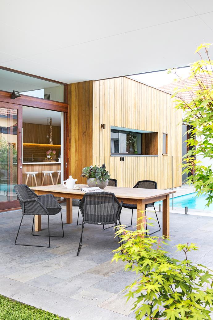 The outdoor dining area is nestled between the pool and an expanse of lawn. Caneline outdoor dining chairs, [DesignFarm](http://www.designfarm.com.au/?utm_campaign=supplier/|target="_blank"). Doors and windows by [Cockburn Joinery](http://www.cockburnjoinery.com.au/?utm_campaign=supplier/|target="_blank") (throughout). Exterior cladding is Trendplank in Pacific Teak, [Mortlock Timber](http://www.mortlock.com.au/?utm_campaign=supplier/|target="_blank"). Bluestone pavers, [Eco Outdoor](https://www.ecooutdoor.com.au/?utm_campaign=supplier/|target="_blank").