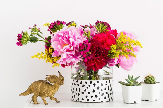 **Update your decor:** An ordinary glass vase can be completely reinvented by a small strip of removable wallpaper. Get the DIY [here](http://www.brit.co/ways-to-reuse-wallpaper-tutorial/?utm_campaign=supplier/|target="_blank"|rel="nofollow"). Photo via [Brit + Co](http://www.brit.co/?utm_campaign=supplier/|target="_blank"|rel="nofollow")