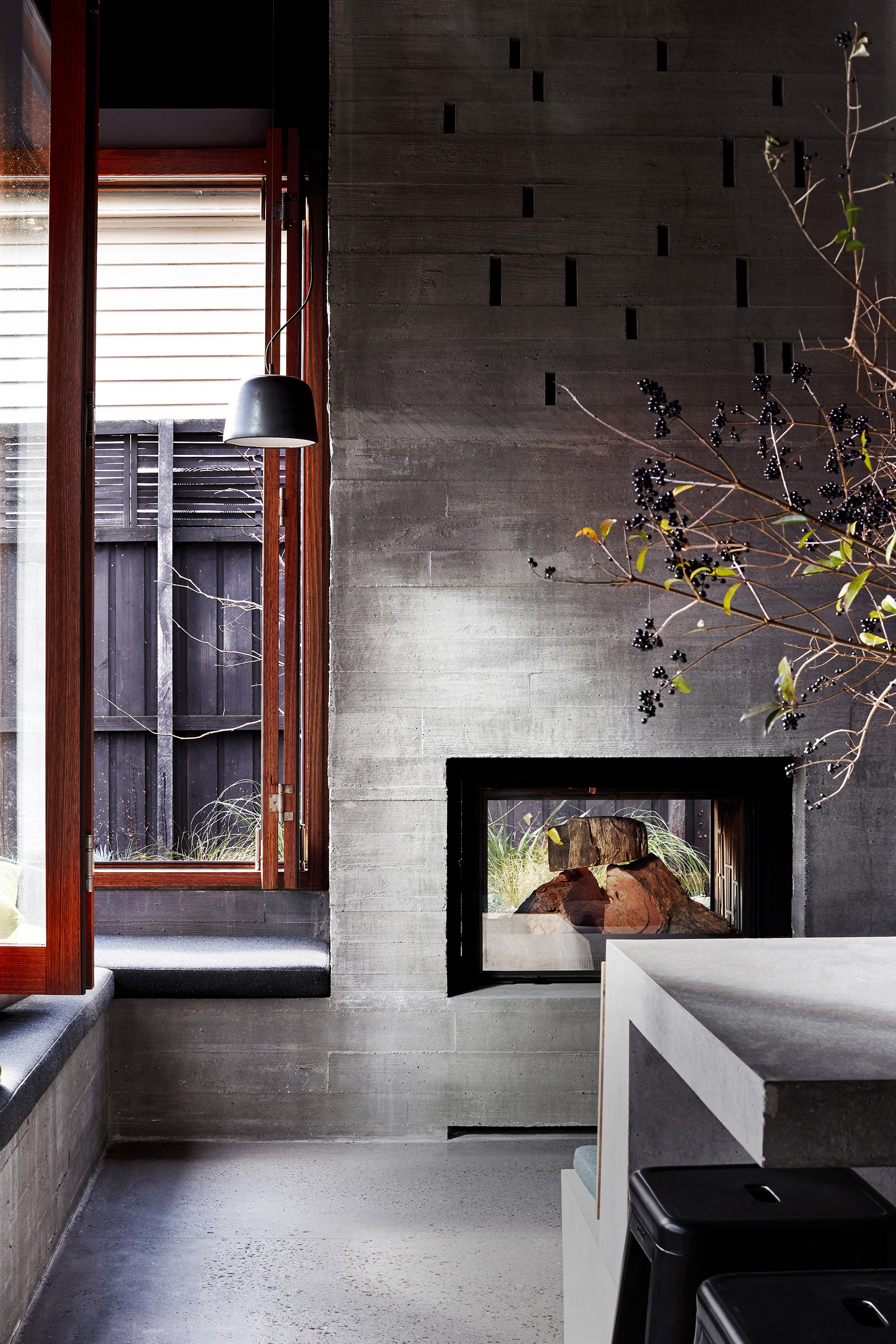 This [fashionable fireplace](https://www.homestolove.com.au/fashionable-fireplaces-for-winter-1605|target="_blank") is the focal point of the kitchen in [this suburban home in Melbourne's St Kilda](http://www.homestolove.com.au/architects-serve-up-cafe-aesthetic-for-suburban-home-3089|target="_blank") with a cafe aesthetic.