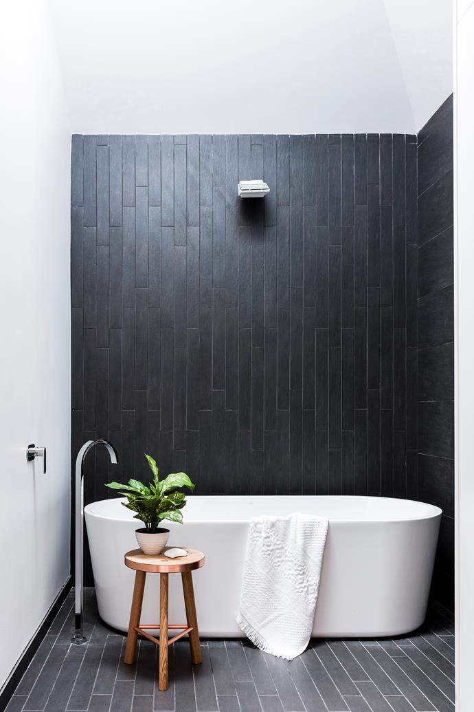A lightwell illuminates moody charcoal ceramics. “At night, LED strip lighting makes the water from the rainshower glisten,” says Carlo. Forme bath, [Harvey Norman](http://www.harveynorman.com.au/?utm_campaign=supplier/|target="_blank"). Ellisse tap, [Parisi](http://www.parisi.com.au/?utm_campaign=supplier/|target="_blank"). Tiles, [Skheme](http://www.skheme.com/?utm_campaign=supplier/|target="_blank"). Stool, [Koskela](http://www.koskela.com.au/?utm_campaign=supplier/|target="_blank"). Towel, [Citta Design](http://www.cittadesign.com/?utm_campaign=supplier/|target="_blank").
